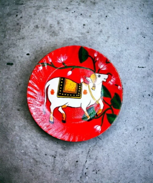Alluring Pichwai Cow Decorative Plate | Red & Pink | Home Decor | Wall Hanging | 10 inch Art Culture Decor Plates, Artwork, Bengali Art Culture Decor Plates, Decor Plates, Decorative Items, Decorative Plates, Decorative Wall Art, Drawing Room, Eco-Friendly, Handcrafted, Handicrafts, Handmade, Handpainted, Home Decor, Home Interior Decoration, Living Room, Melamine Decor Plates, Paintings, Pichwai Cow, Pichwai Cow Decor Plates, Religious Decor Plates, Wall Art, Wall Decor, Wall Hanging, Wall Plates